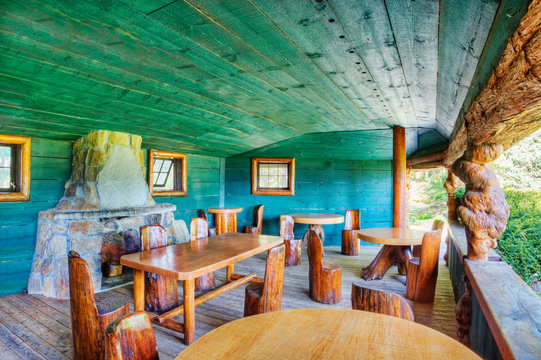 Rustic chairs and tables on restaurant patio