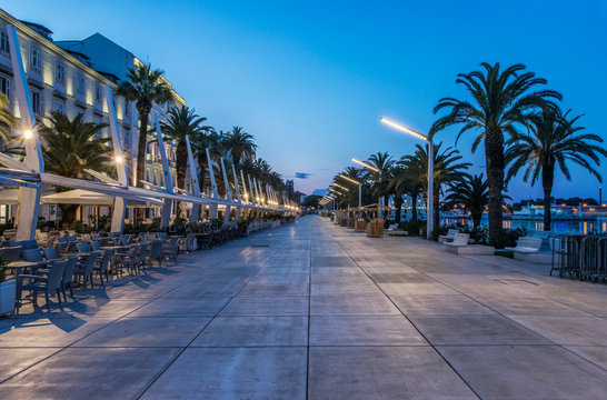 Promenade, buildings and city sidewalk at dusk, Split, Split, Croatia
