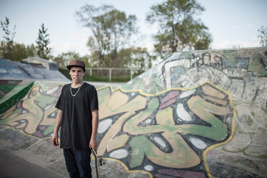 Caucasian man standing at skate park