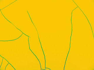 yellow abstract background. the paint is cracked