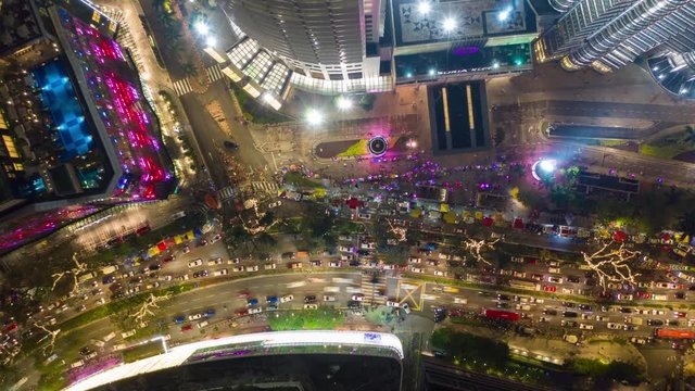 kuala lumpur city downtown night time illuminated famous traffic street aerial topdown panorama 4k timelapse malaysia 