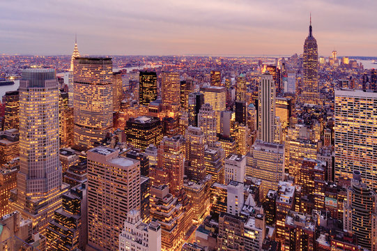 Aerial view of highrise buildings in cityscape at twilight