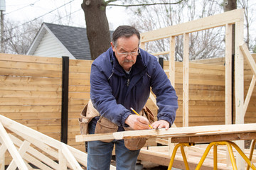 carpenter working on wood structure