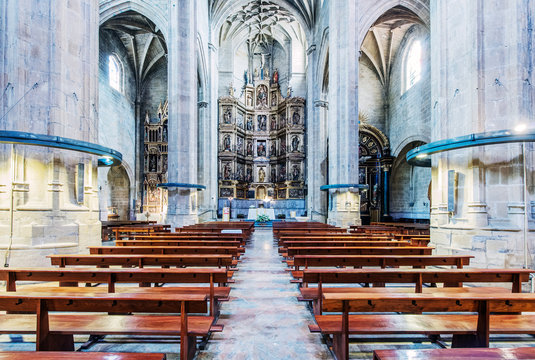 Pews and arches in ornate church