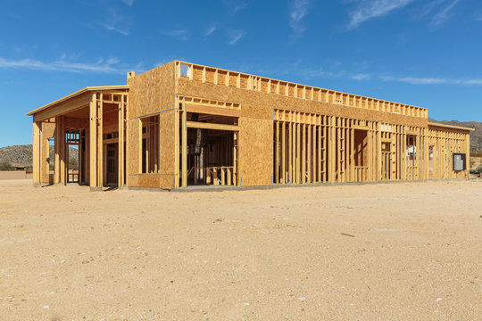 Construction of house under blue sky