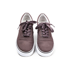 A pair of brown canvas shoes isolated on white