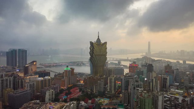 sunset time flight over macau city downtown bay aerial panorama 4k timelapse china