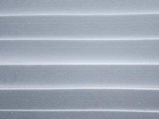 Polystyrene insulation boards background with copyspace and accented sharpness on edges