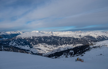 Fototapeta na wymiar Winter panorama of mountains in Pitztal Hoch Zeiger ski resort in Austria Alps. Ski slopes. Beautiful winter day.