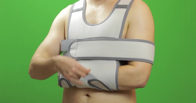 Man shoulder injury. Bandage for fixing of an elbow joint and a humeral belt