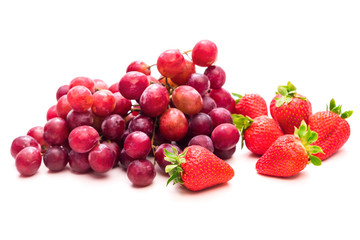 Fruits. Pink grapes and red strawberries. Bunch. Isolate on white background