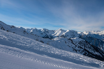 Fototapeta premium Winter panorama of mountains in Pitztal Hoch Zeiger ski resort in Austria Alps. Ski slopes. Beautiful winter day.
