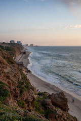 Beautiful View on the Ocean Coast duing a vibrant sunset at the Apollonia Beach. Taken in Herzliya, Tel Aviv District, Israel.