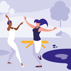young interracial girls dancing in the park