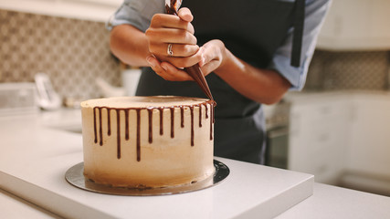 Pastry chef decorating cake