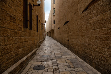 Fototapeta premium Street view of the Ancient Old City during a cloudy day. Taken in Jerusalem, Israel.