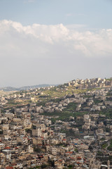 Fototapeta na wymiar Aerial cityscape view of Jabal Batin alHawa residential neighborhood during a cloudy day. Taken in Jerusalem, Israel.