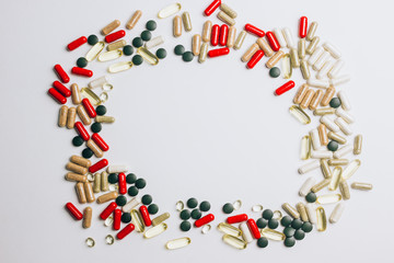 Various medications and vitamins, a pill bottle.
