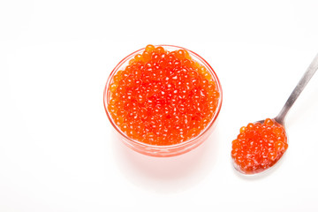 red caviar in glass bowl with spoon isolated on white background