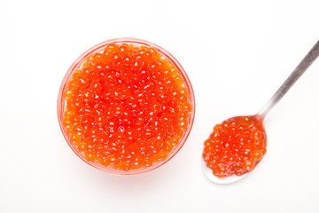 red caviar in glass bowl with spoon isolated on white background