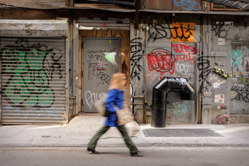 Blurry Woman Walking in the City