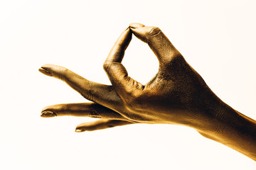 Closeup of woman's hands meditating, guan mudra on white background