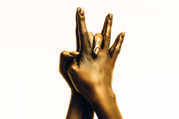 Image of woman golden hand in shakya muni hat mudra, on a white background