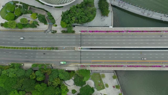 sunny singapore city downtown marina traffic bay road aerial topdown panorama 4k 