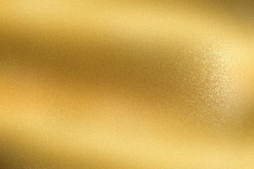 Glowing golden wave metal wall, abstract texture background