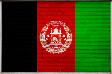 Close-up of old metal wall with national flag of Afghanistan. Concept of Afghanistan export-import, storage of goods and national delivery of goods. Flag in grunge style