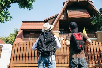 Asian backpack couple tourist walking in the city