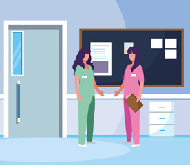 female medicine workers in hospital corridor