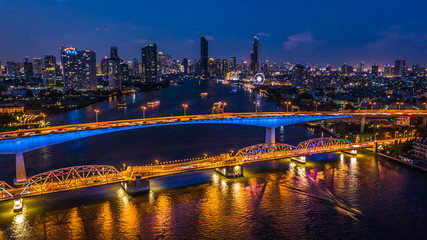 Fototapeta na wymiar Aerial view Bangkok city skyline and skyscraper at night with business building in Bangkok downtown, Chao Phraya River, Bangkok, Thailand.