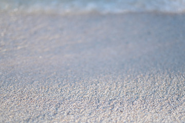 Closeup image of sand on tropical white beach