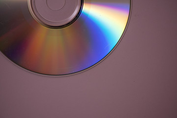 Compact disc isolated against purple background