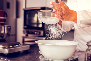 Focused photo on plastic bowl that standing on scales