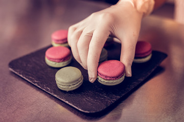 Female hand wearing gloves during delicate work