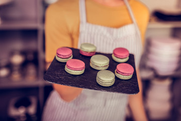 Close up of female hand that holding plate