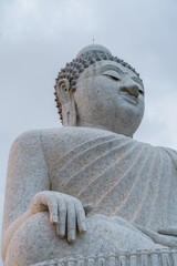 The beautiful buddha sitting in the cloudy sky.
