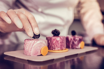 Focused photo on female hand that being in gloves