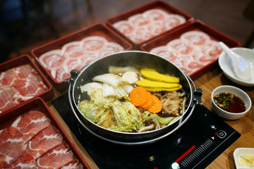 Thinly sliced of raw pork for hot pot also known as Shabu Shabu or Sukiyaki, Traditional Japanese food.