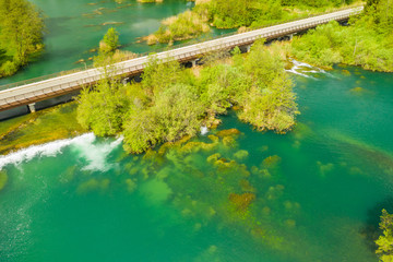 Panoramic view on waterfall and wooden bridge on Mreznica river in Belavici, Croatia