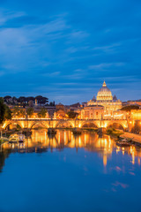 Fototapeta na wymiar Travel in Rome ,Sunset view of Rome St. Peters Basilica in the Vatican and the Ponte Sant'Angelo, Bridge of Angels, at the Castel Sant'Angelo and river Tiber in Rome, Italy,