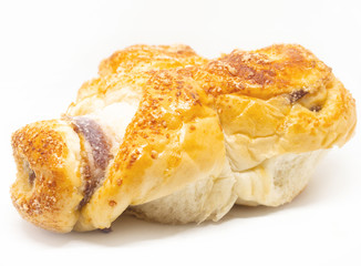 Buttered bread, sugar and stuffed with sausage on a white background