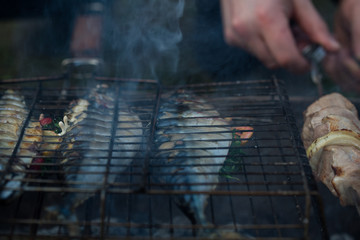 Fragrant mackerel grilled with lemon and spices in the smoke from fire