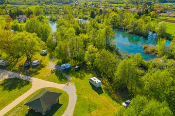 Croatia, green countryside, Mreznica river from air, panoramic view of Belavici village, waterfalls...