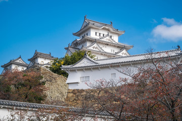 Himeji Castle is the most spectacular castle in all of Japan. The castle, shown here in autumn is also known as White Egret or White Heron Castle due to its pristine white exterior architecture.