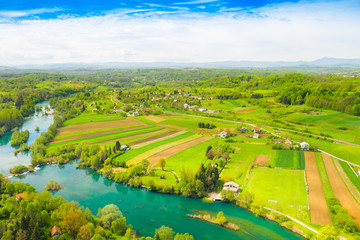 Croatia, green countryside, Mreznica river from air, panoramic view of Belavici village, waterfalls...
