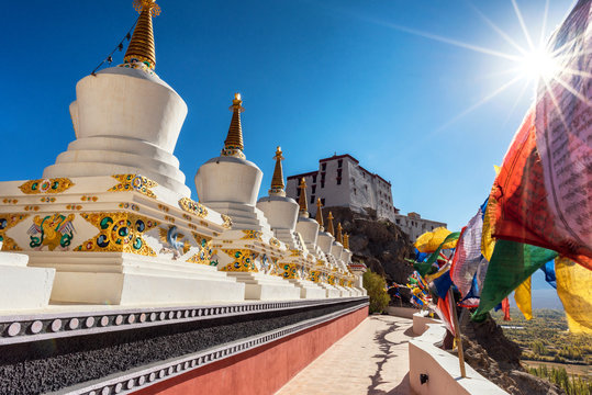 Beautiful white stupa and colorful praying flag in tiksey monastery , Leh - Ladakh . Northern of India