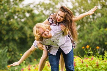 couple having fun piggyback riding